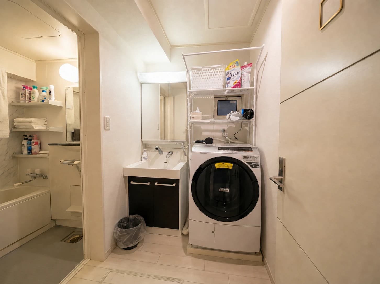 Ground-floor washbasin, shower room and washer-dryer at MEME Hotel Tokyo